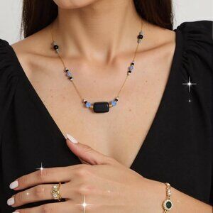 Black and Basic. Sky blue glass beads and black onyx floating choker made with b